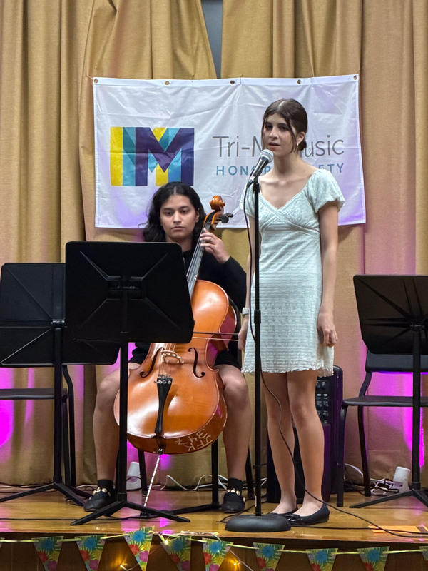 Students performing on stage.