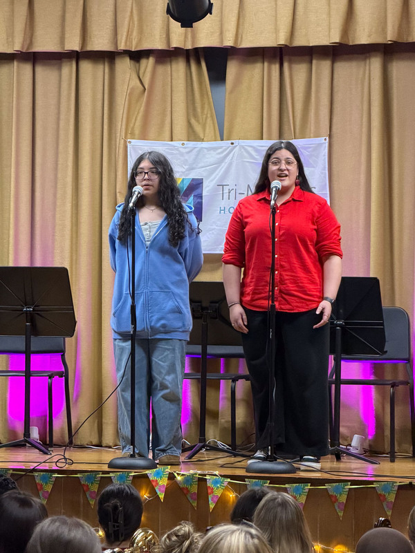 Students performing on stage.