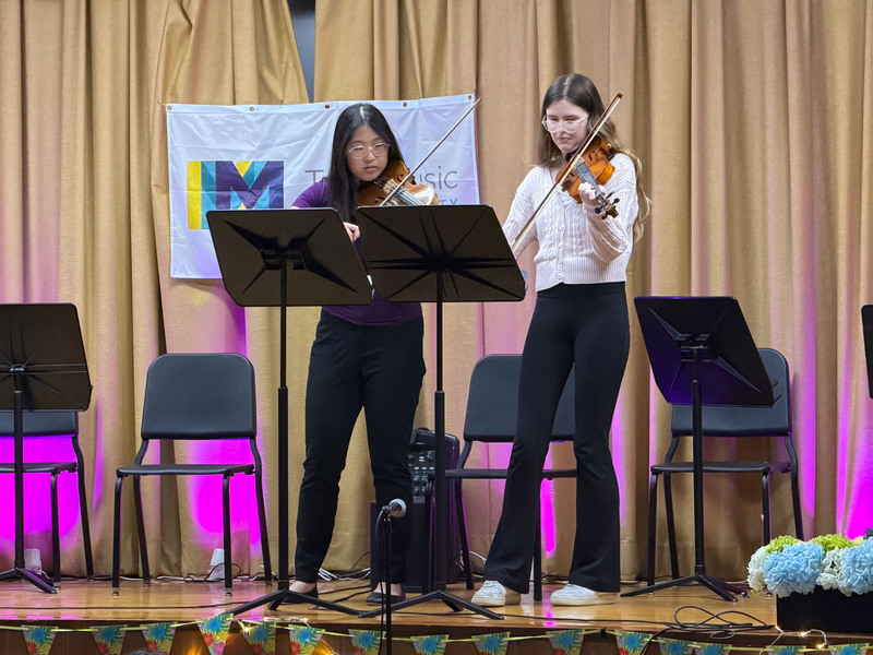 Students performing on stage.