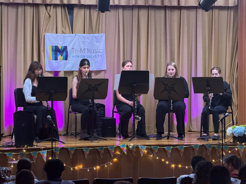 Students performing on stage.