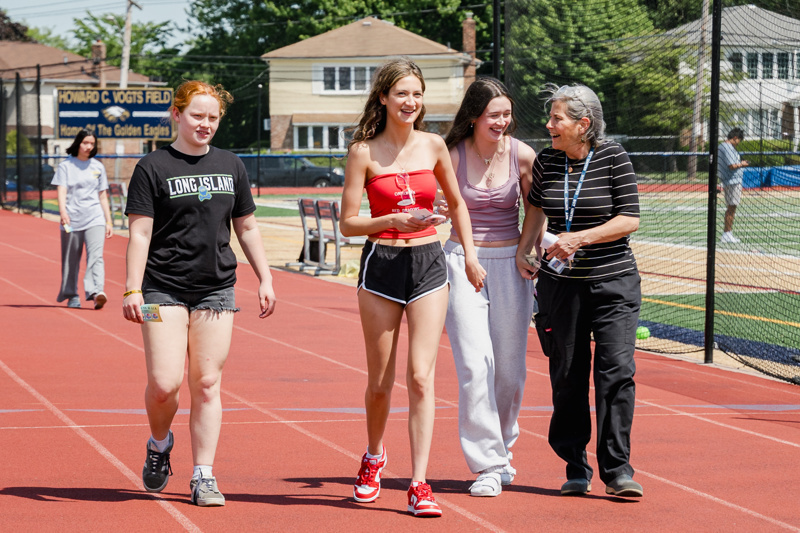 women walking on track