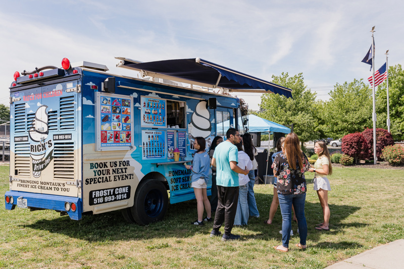 ice cream truck in grassy area