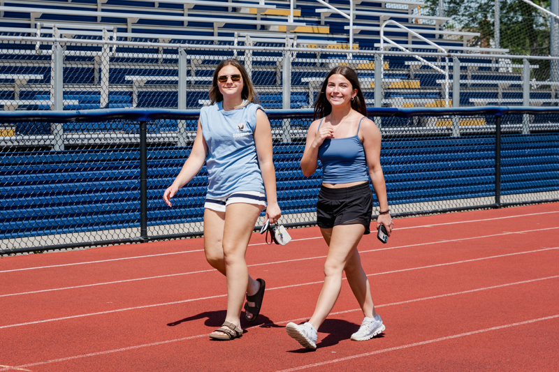 women walking on track