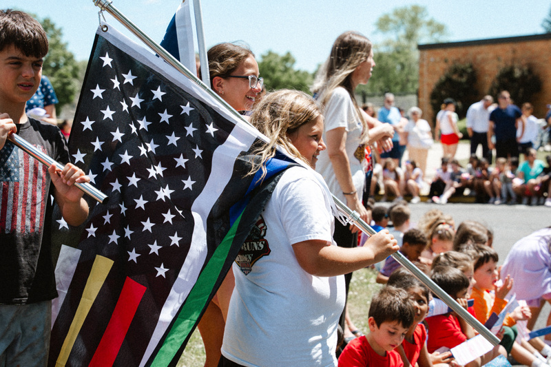 student with large flag