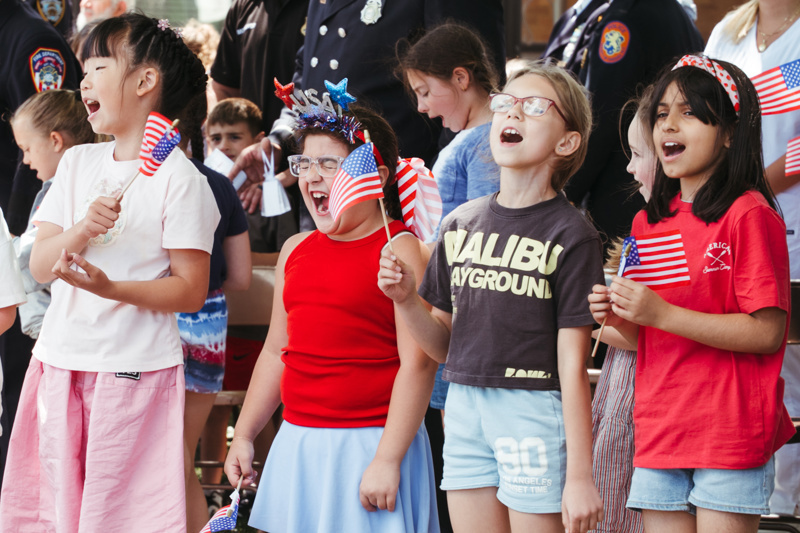 kids celebrating with flags