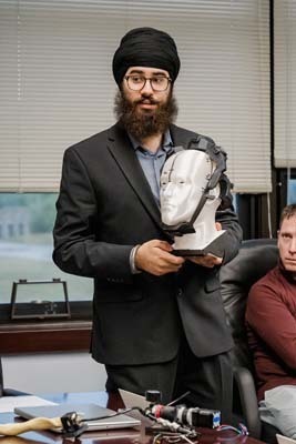 BHS junior demonstrates mind-controlled exoskeleton at board meeting