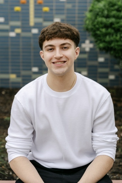student image of boy in white shirt
