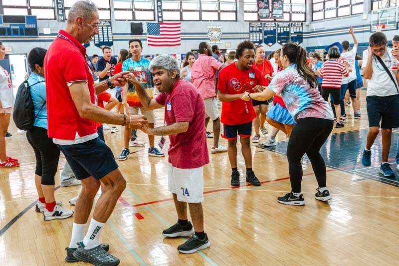 Students and teachers dancing.