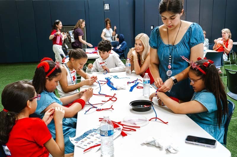 Students working at table.