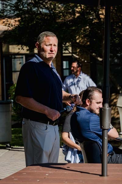 Man giving speech outside.