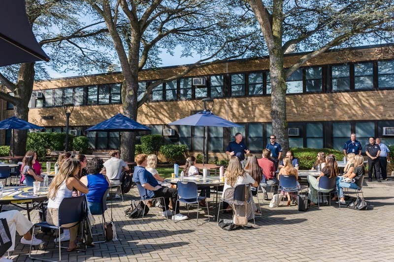 Teachers outside during event.