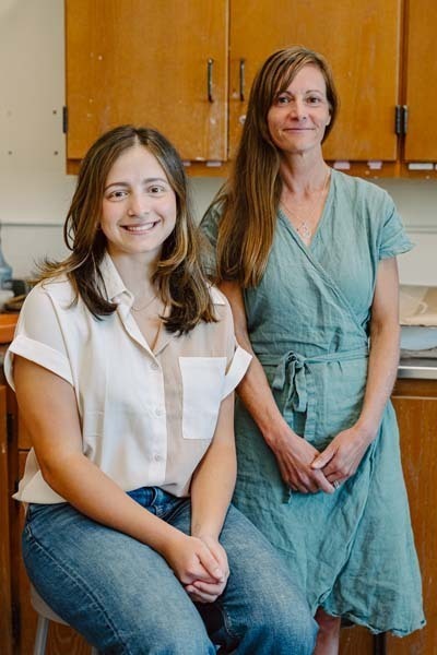 Student smiling with teacher.