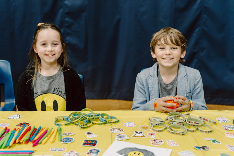 Children at yellow craft table