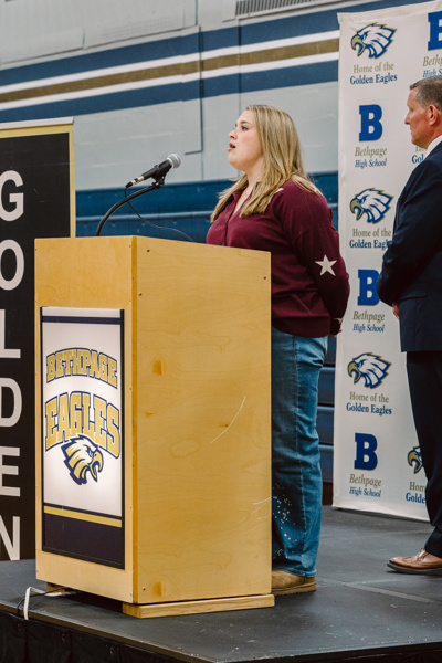 woman speaking at podium