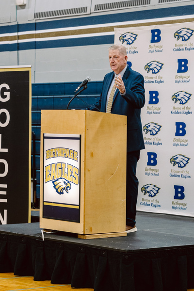 man speaking at podium