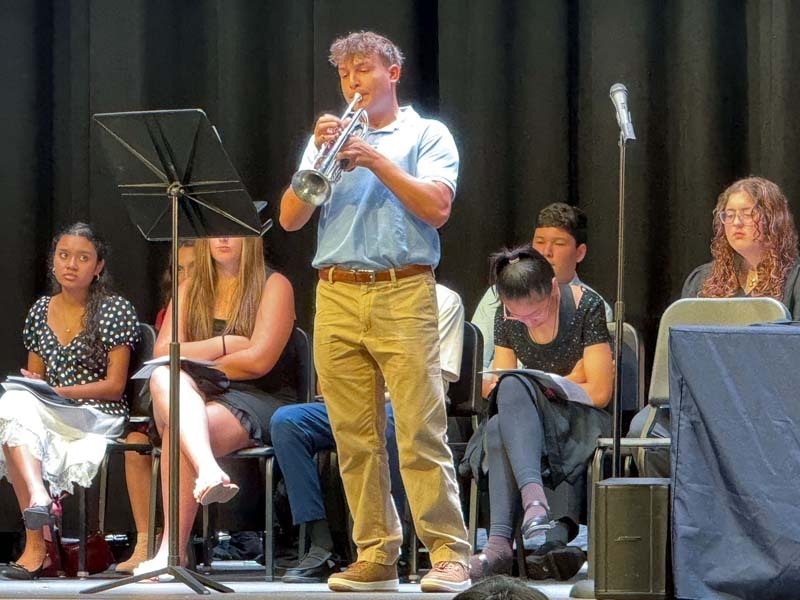 Student band playing on stage.
