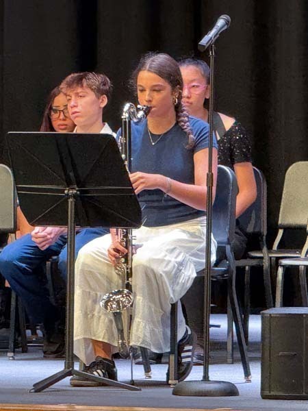 Student band playing on stage.