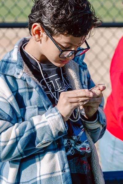 Student working on small project outside.