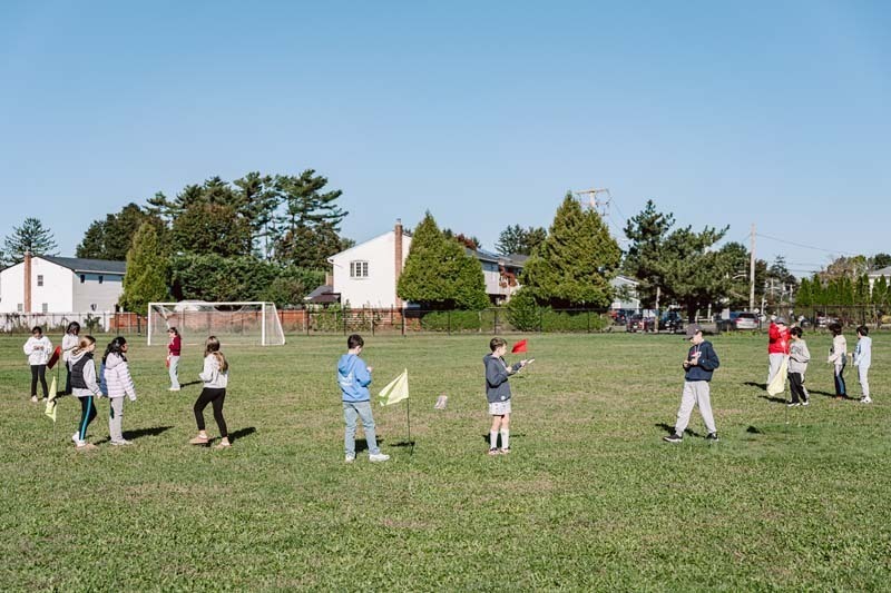 Students playing on field.
