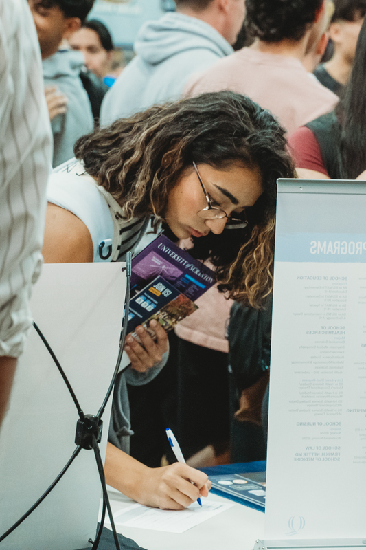 Students at College Fair Booths