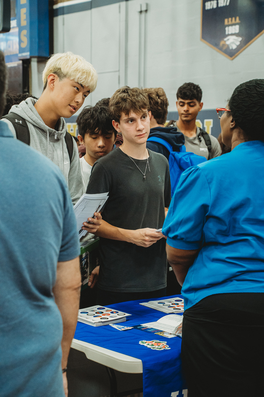 Students at College Fair Booths