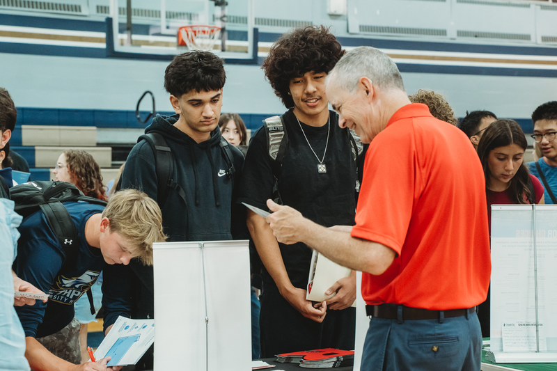 Students at College Fair Booths