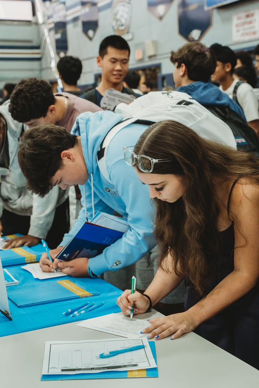 Students at College Fair Booths