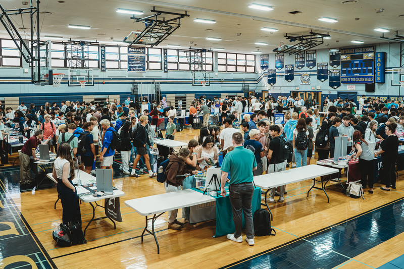 Students at College Fair Booths