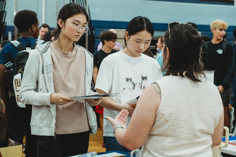 Students at College Fair Booths
