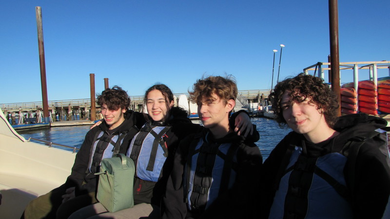Students prepared to set sail with lifejackets.