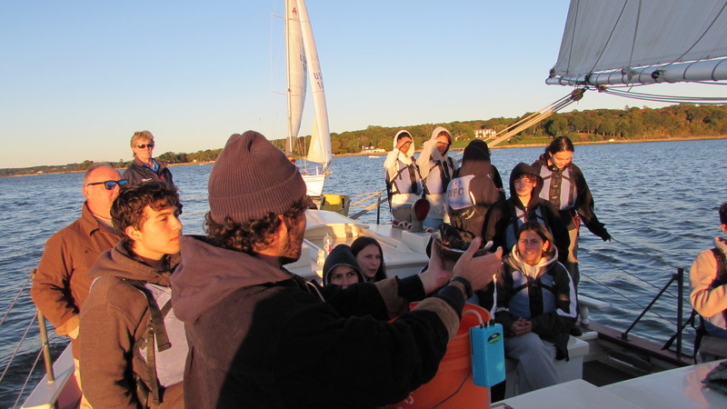 Students set sail with lifejackets with Mr. Portuese.
