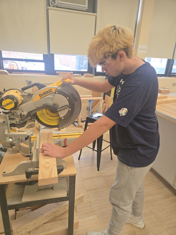Student uses power tool during Home Improvement class at Bethpage High School.