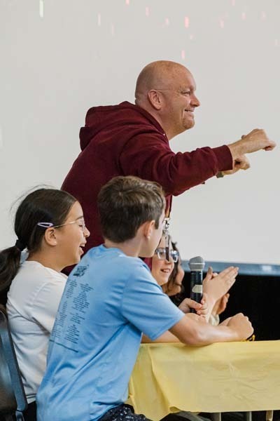 Students listening to man speak.