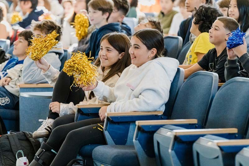 Students listening to man speak.