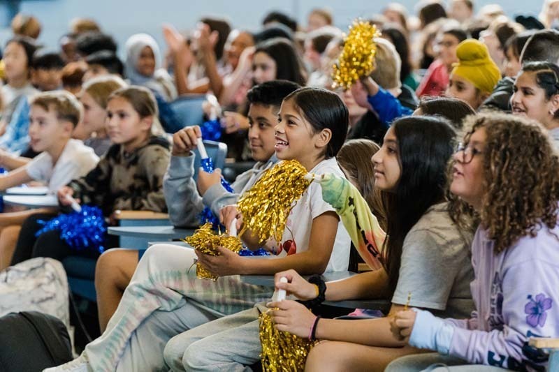 Students listening to man speak.