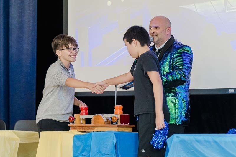 Students listening to man speak.