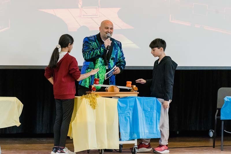 Students listening to man speak.