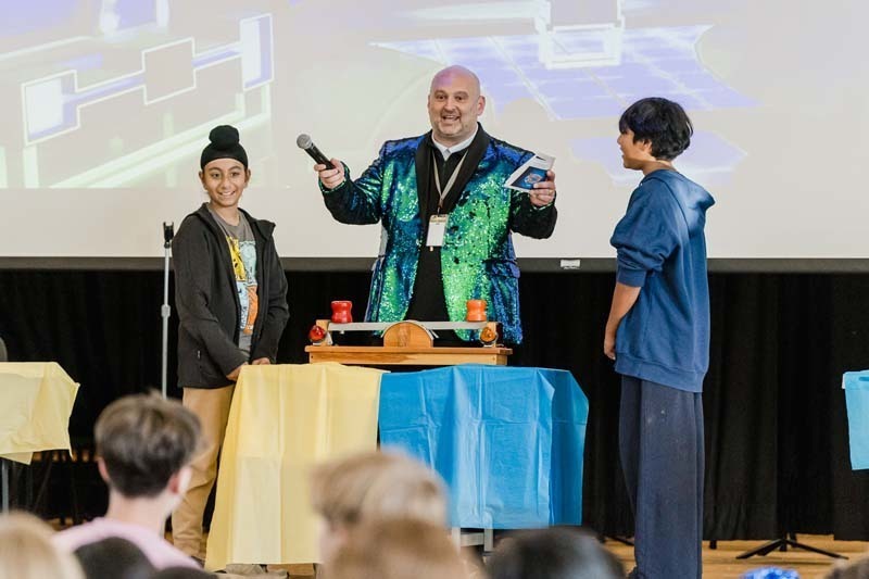 Students listening to man speak.