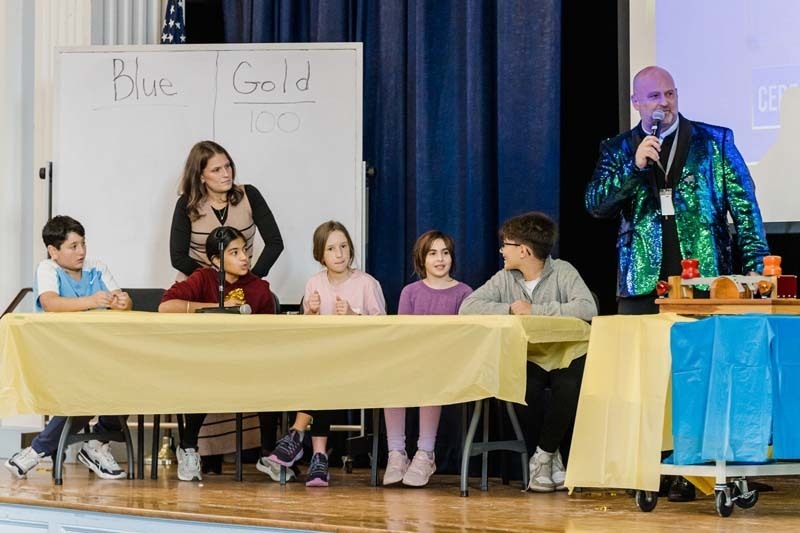 Students listening to man speak.