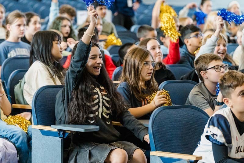 Students listening to man speak.