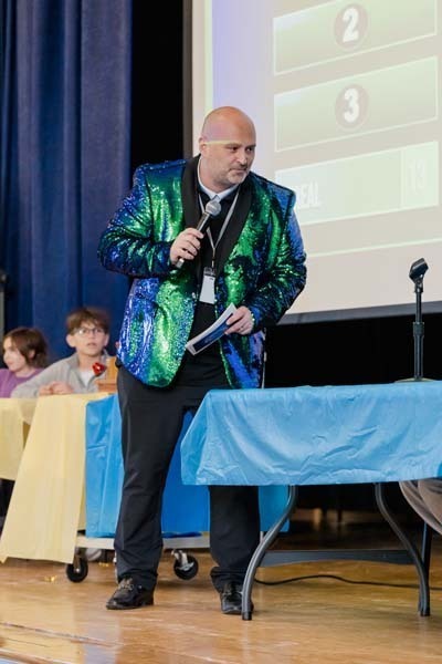 Students listening to man speak.