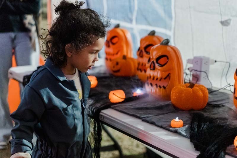 Students outside in Halloween costumes.