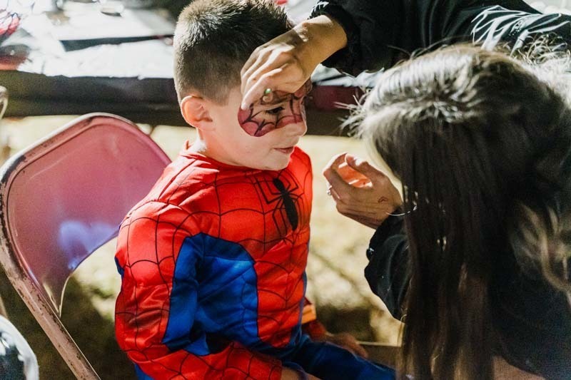 Students outside in Halloween costumes.