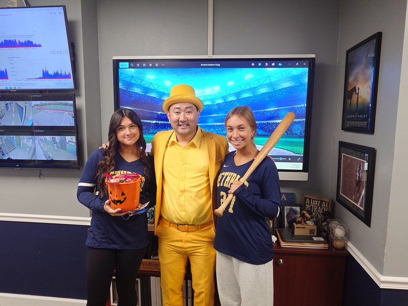 Allie, Mr. Choi, and Gabriellla celebrate Halloween.