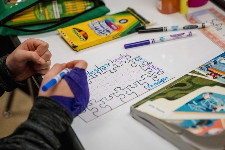 Students giving demonstration to younger kids.