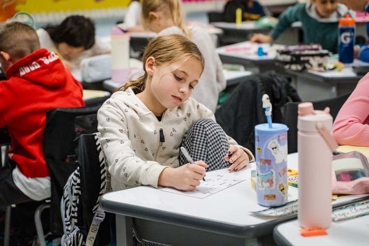 Students giving demonstration to younger kids.