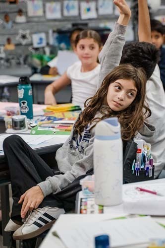 Students giving demonstration to younger kids.