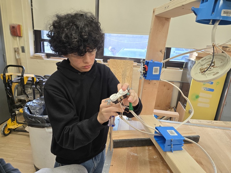 Student in Bethpage High School's Home Improvement Class master electrical circuits!