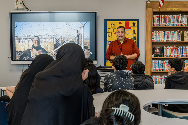 Verdi speaking to students