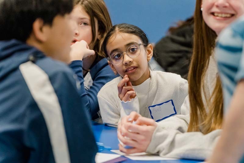 Bethpage High School athletes returned to their elementary school roots on Dec. 5, bringing mentorship and inspiration to fifth graders at Charles Campagne School through the Athletes Helping Athletes program.